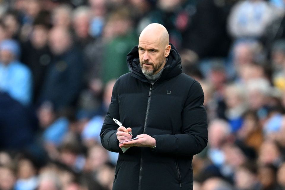 MANCHESTER, ENGLAND - MARCH 03: Erik ten Hag, Manager of Manchester United, looks on as he takes notes during the Premier League match between Manchester City and Manchester United at Etihad Stadium on March 03, 2024 in Manchester, England. (Photo by Michael Regan/Getty Images)