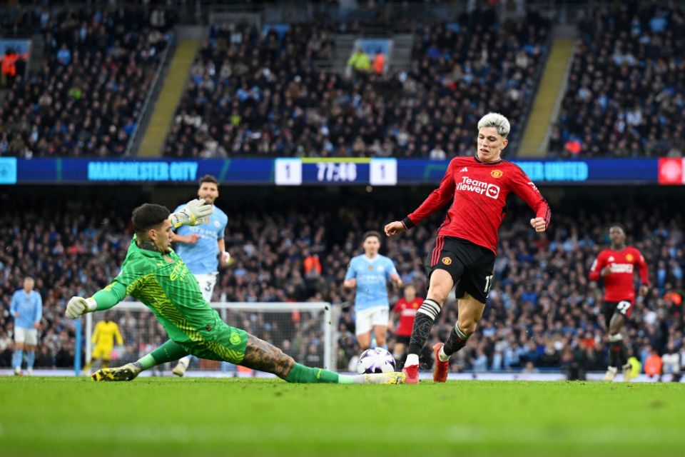 MANCHESTER, ENGLAND - MARCH 03: Alejandro Garnacho of Manchester United is challenged by Ederson of Manchester City during the Premier League match between Manchester City and Manchester United at Etihad Stadium on March 03, 2024 in Manchester, England. (Photo by Michael Regan/Getty Images)