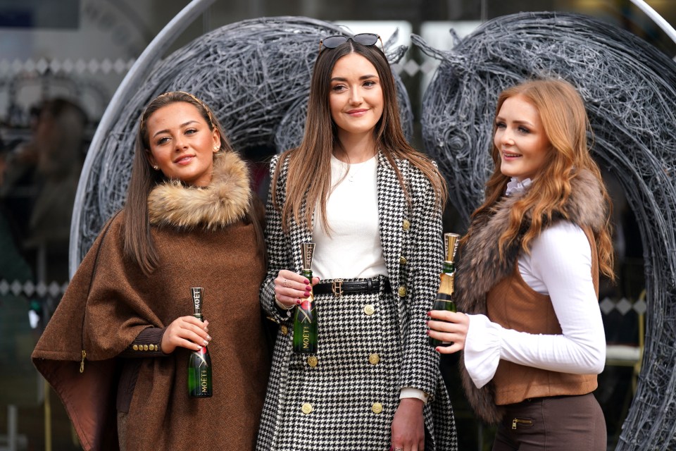 Three friends posed as they arrived for the third day of Cheltenham Festival