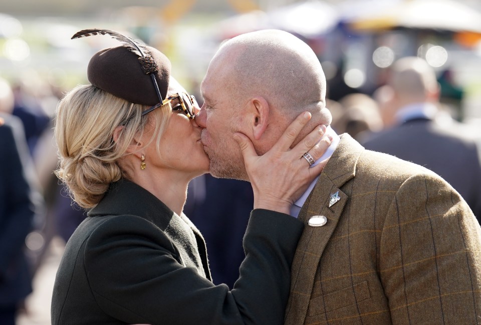 Zara and Mike Tindall packing on the PDA on the final day of the Cheltenham Festival