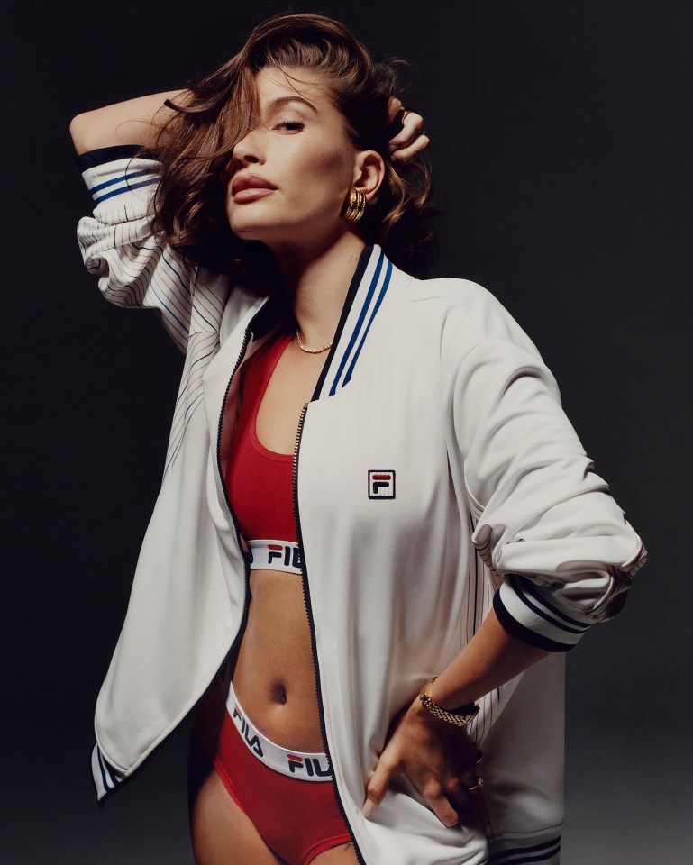 Hailey Bieber stunned as she modelled a jacket over a red sports bra and matching knickers