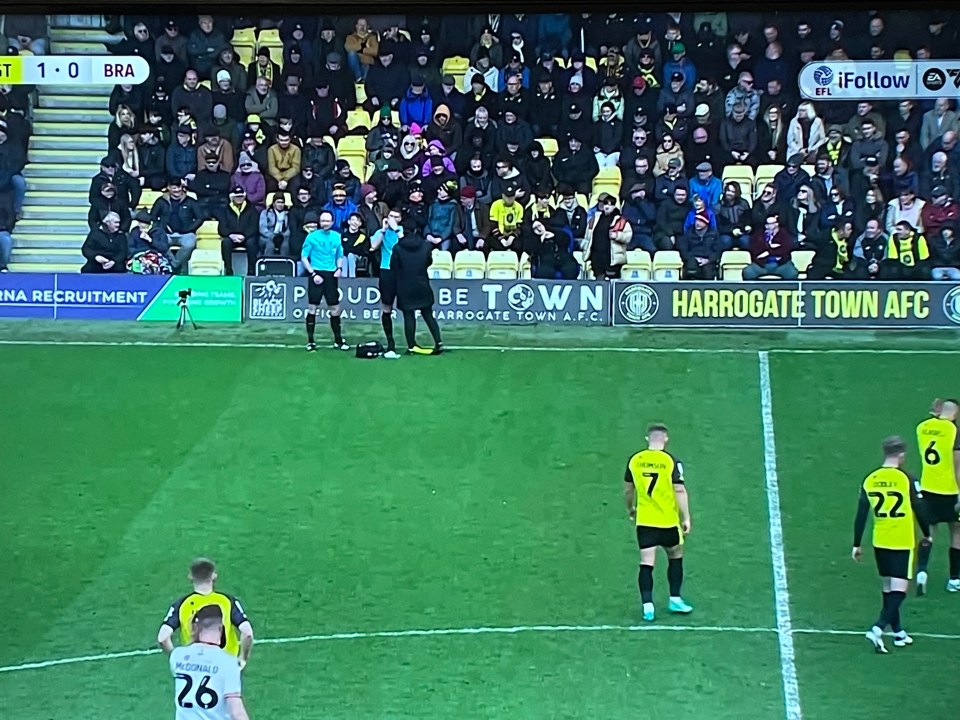 The linesman was treated on the pitch before play continued almost 10 minutes later