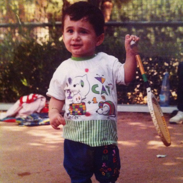 Hazem's brother Amer pictured as a child with a tennis racket - their father is a coach