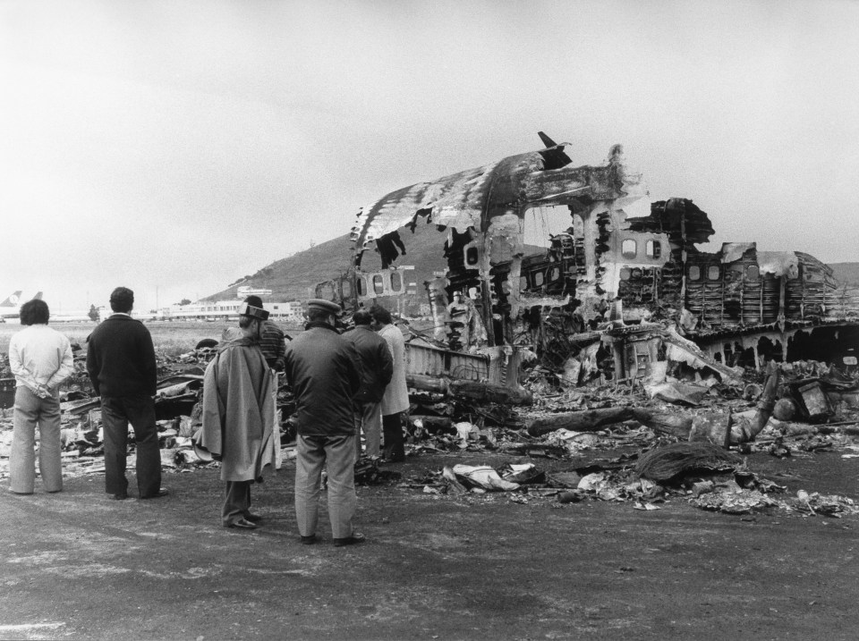 People inspect the wreckage after the catastrophe in Tenerife