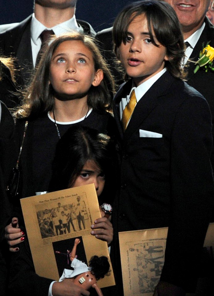 Paris with her brothers at a memorial service a month after her dad's death