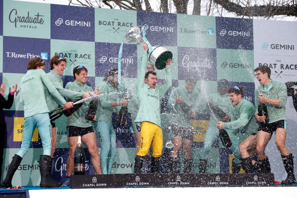 Rowing - University Boat Race - Oxford v Cambridge - River Thames, London, Britain - March 26, 2023 Cambridge's Ollie Boyne, Luca Ferraro, Oliver Parish, Seb Benzecry, Tom Lynch, Brett Taylor, Noam Mouelle, Nicholas Mayhew, Matt Edge and coxswain Jasper Parish celebrate with the trophy after winning the men's race Action Images via Reuters/Peter Cziborra