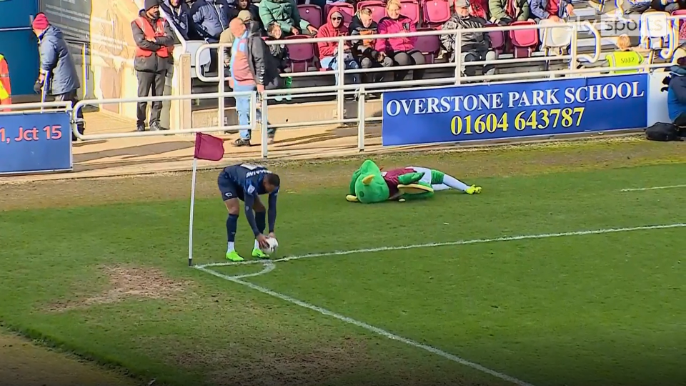 The mascot rolled around on the floor pretending to be injured