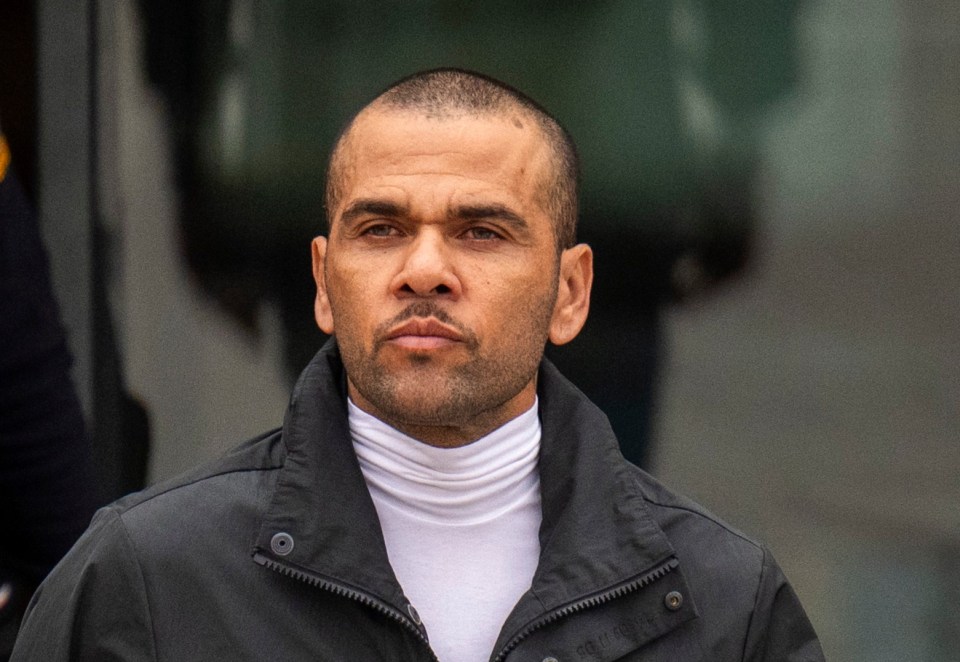 Stony-faced footballer Dani Alves was silent as he was released from jail on Monday pending an appeal on his rape conviction