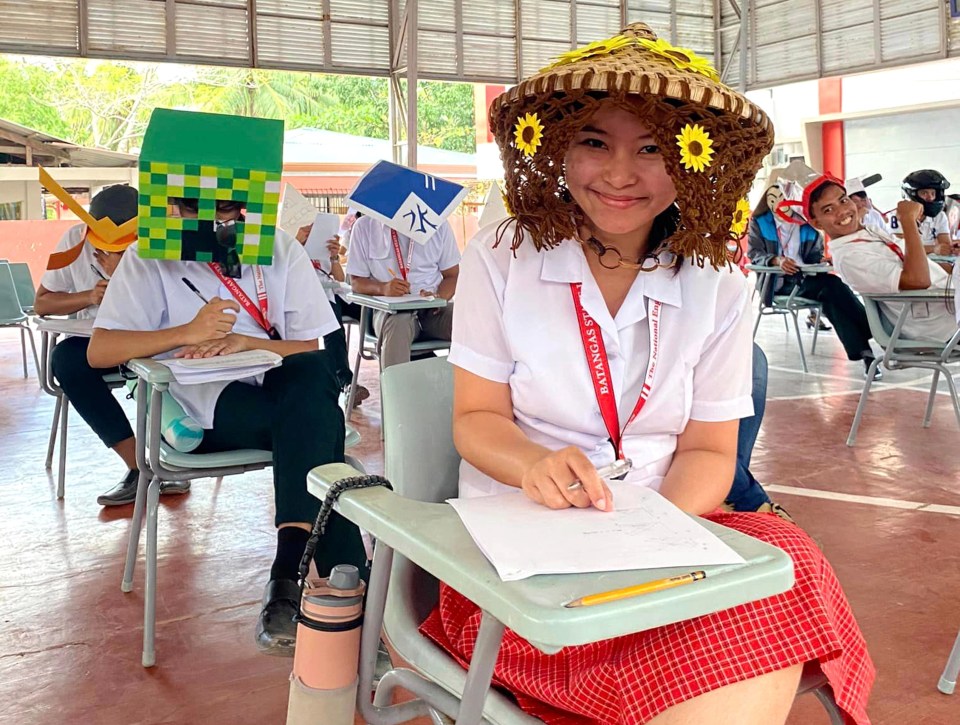 The hats prevented the students, aged 18 to 19, from looking at their fellow classmates’ answers to cheat