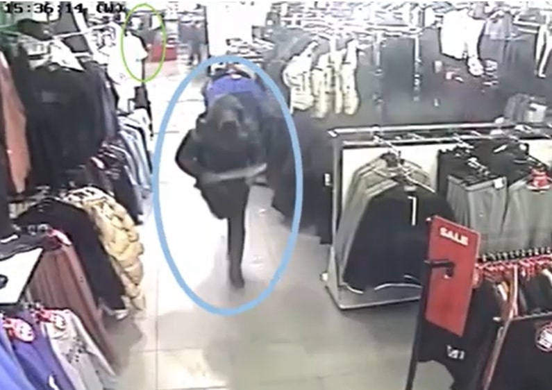 The moment Joshua Howell charged into the clothing shop with a huge machete