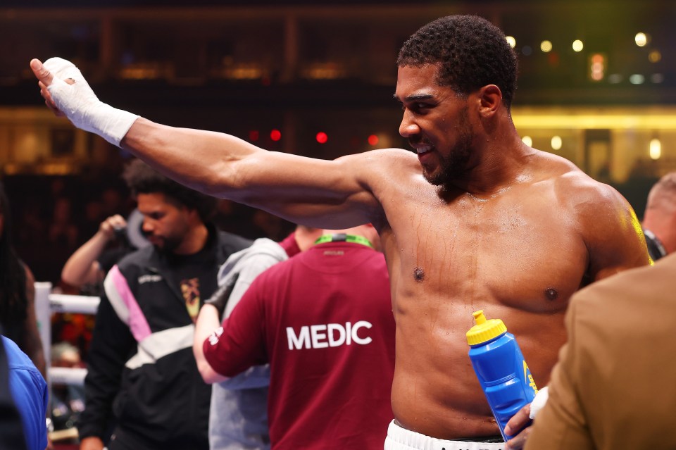 Anthony Joshua celebrates his fourth win in his last four outings