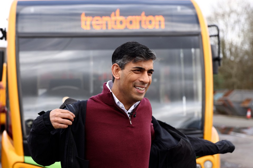 Rishi Sunak arrives to speak to employees at a bus depot in Heanor, northern England