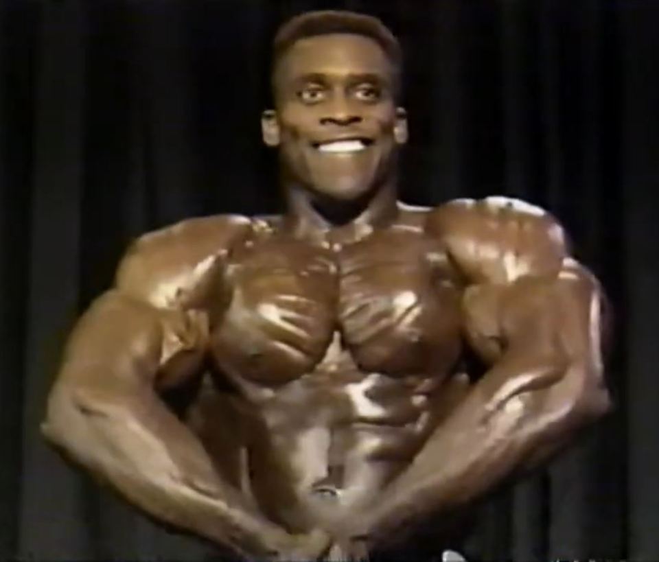 Morant flexes for the camera during the 1989 NPC North American Championships