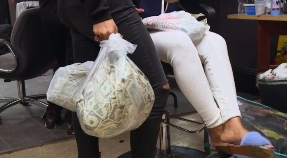 A staff member shows some of the cash earned during Channel 5’s investigation