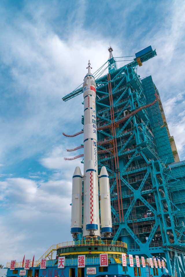 The Shenzhou-13 manned spaceship and a Long March-2F carrier rocket are seen at the launching area of Jiuquan Satellite Launch Centre in China