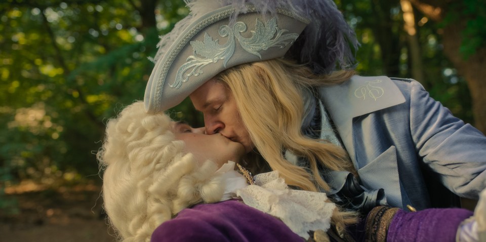 Connor Swindells plants a kiss on a co star in The Completely Made Up Adventures of Dick Turpin