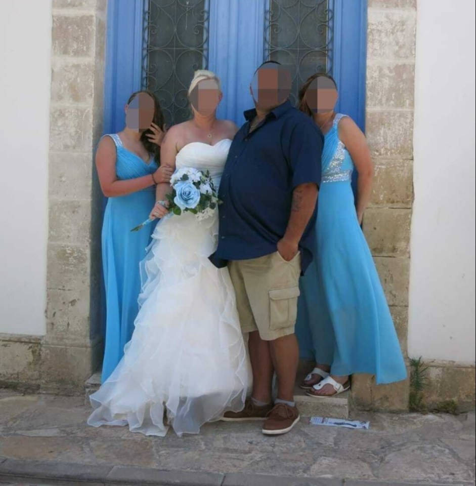 Wedding photo of a bride, groom, and bridesmaids.