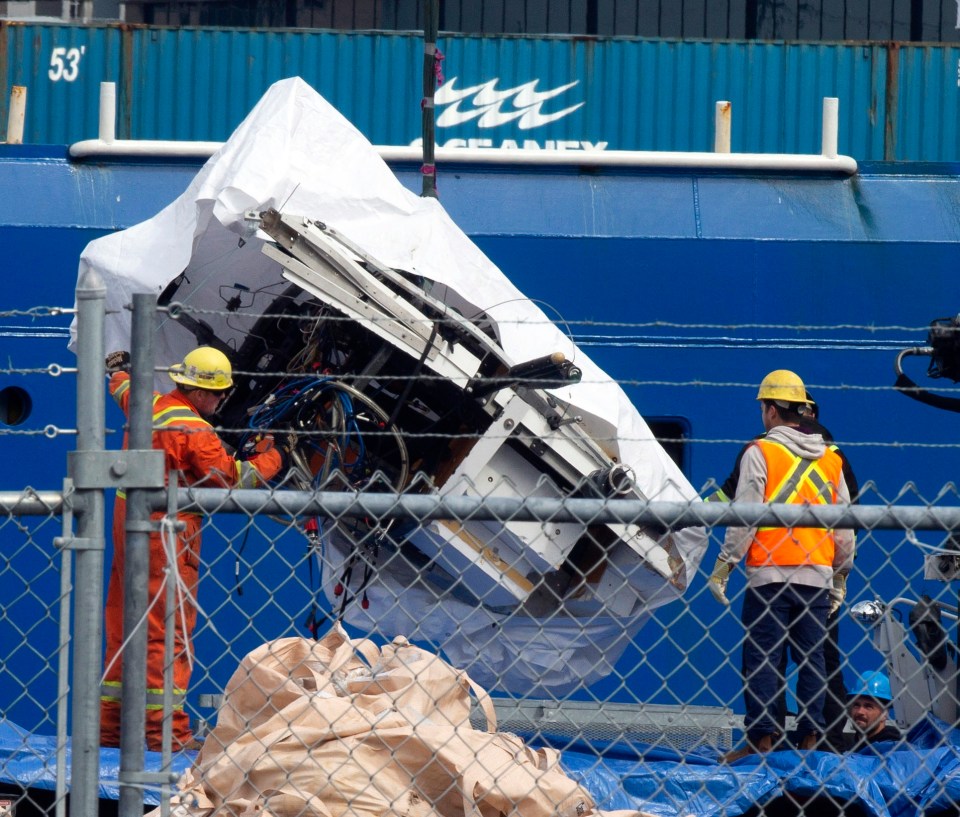 Debris from the Titan submersible is recovered from the ocean floor