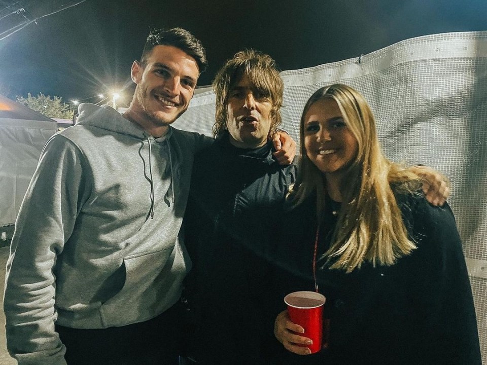 Declan Rice and girlfriend Lauren Fryer pose for a picture with singer Liam Gallagher.