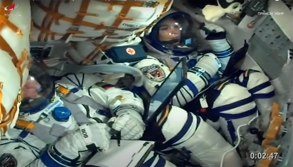 Video showed the three crew members strapped inside ready for the mission