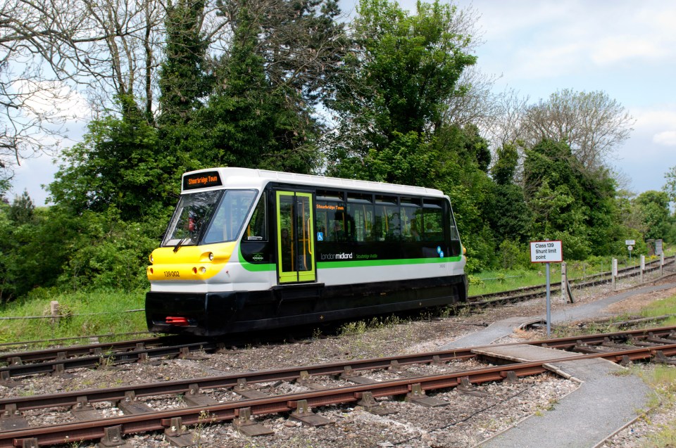 Two tiny one-carriage Class 139 'Parry People Movers' ferry passengers along the short 0.8mile track