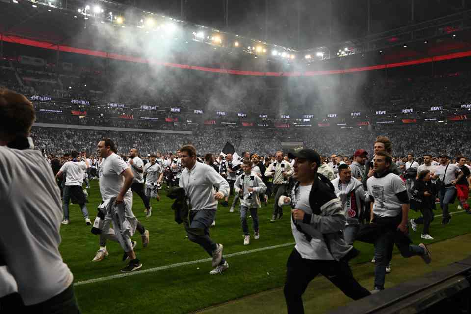 A mass pitch invasion by Eintracht Frankfurt fans following Europa League win