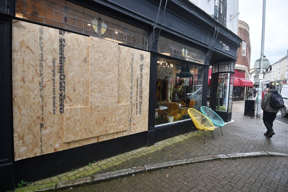 A boarded up shop along the high street