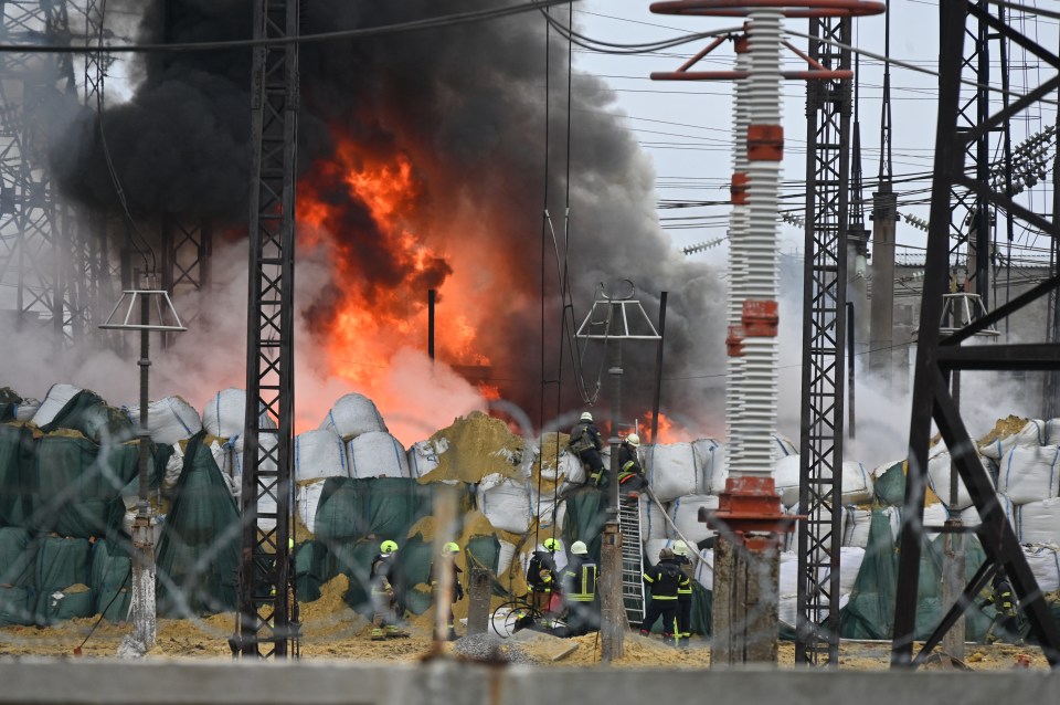 Firefighters extinguish a fire at an electrical substation in Kharkiv today