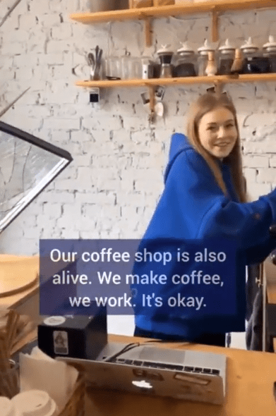 The brave young barista continued to serve coffee with a smile on her face