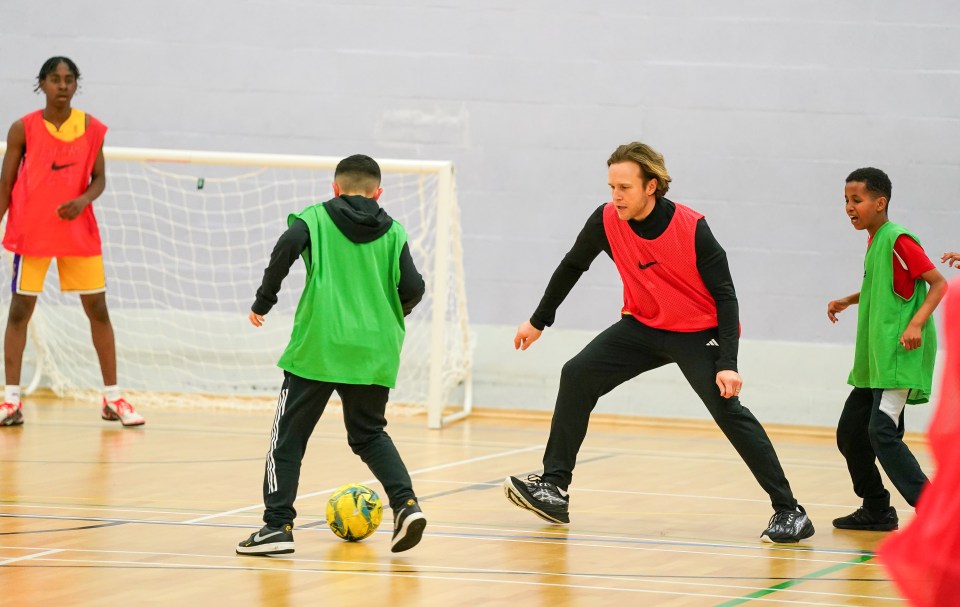 Olly enjoyed a kickabout with young players from Crown and Manor football club in Hackney earlier this year