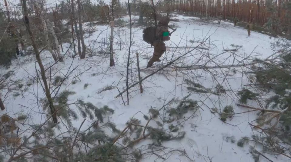 The Ukrainian troops make a run for it after being spotted by a Russian drone