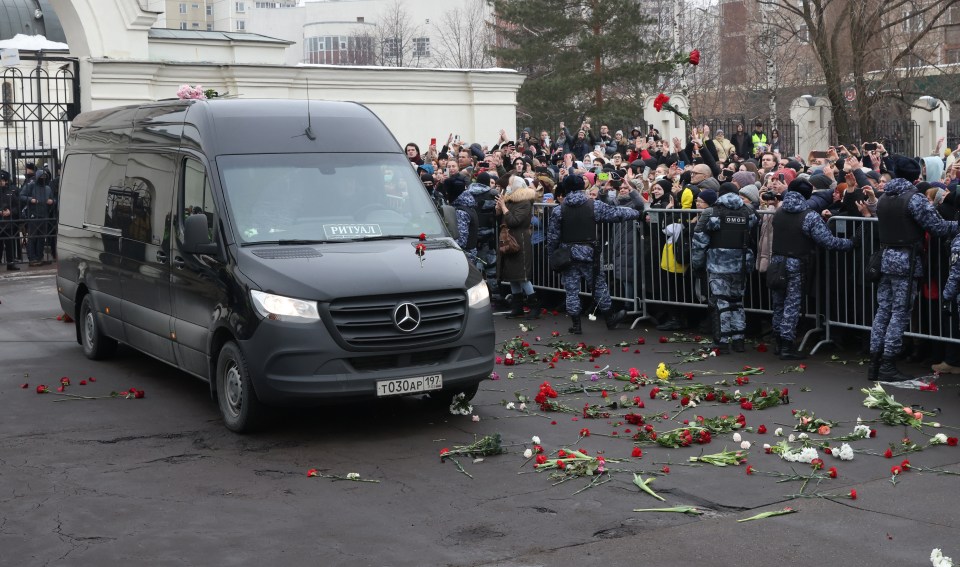 Huge crowds gathered to watch Navalny's hearse drive by