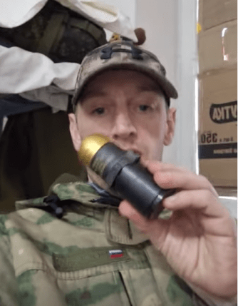 Ben Stimson (pictured posing with a grenade), from Oldham, flew to Russia to fight in Putin's army