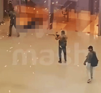 Gunmen open fire as they enter the concert venue last night in Moscow