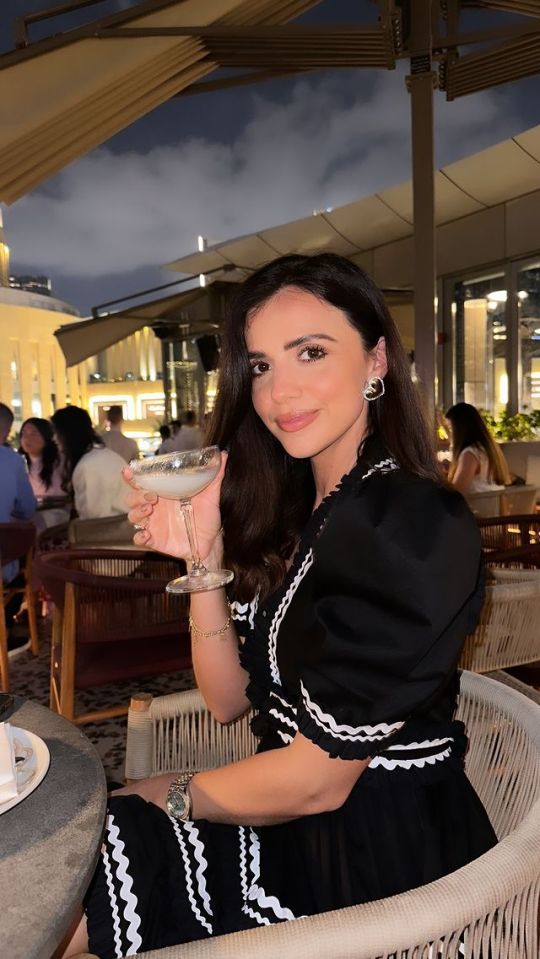 Lucy looked stunning in a black dress as they enjoyed an al fresco cocktail