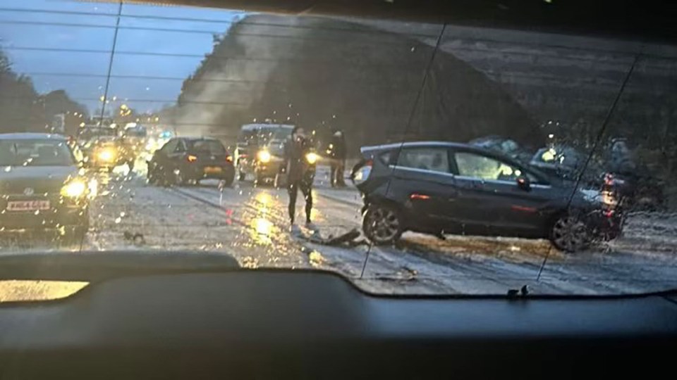 A horror smash involving 15 cars has shut down the M23 between J10 and J11