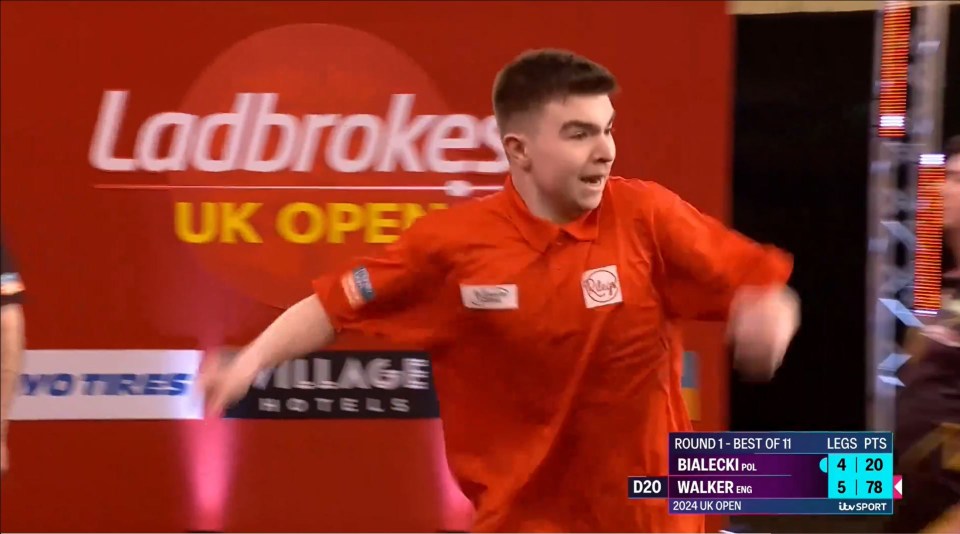 Jenson Walker, 17, nearly falls off stage celebrating epic UK Open win as darts fans say he actually looks about 13