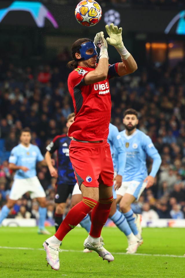 Kamil Grabara - wearing a mask at the Etihad - dropped Julian Alvarez's shot-cross