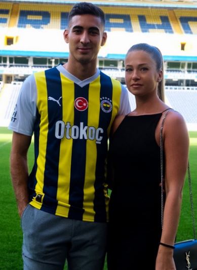 Mert Muldur's girlfriend Koprena Andjela (R) revealed her 'heart stopped' after seing her partner chased by an opposition fan