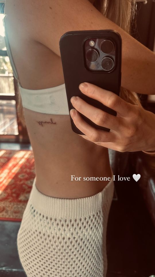 The first appeared to be a name on her rib cage 'for someone I love'