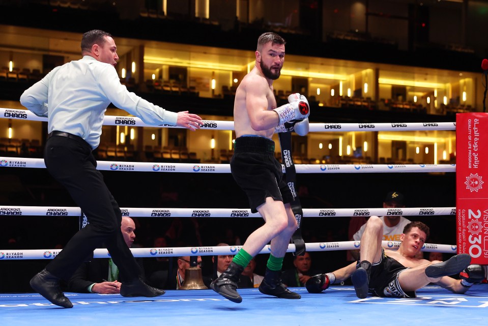 a man in a boxing ring with the word chaos on the ropes