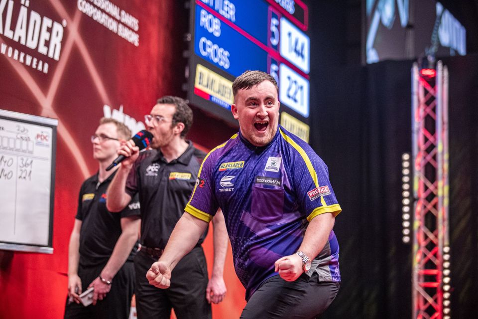 Littler celebrates hitting a nine-darter