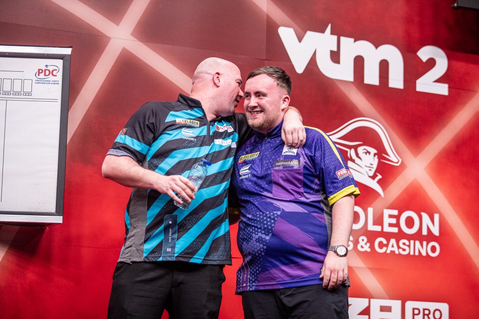 Rob Cross congratulates rival Littler after their epic contest