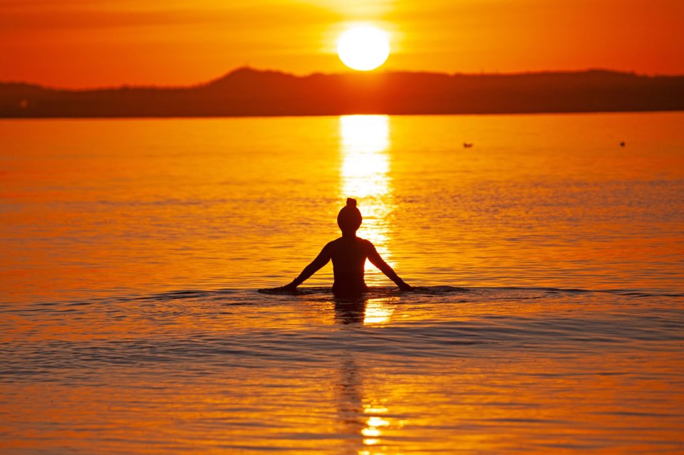 Makiko Konishi takes a cool dip in the Firth of Forth in Scotland at sunrise