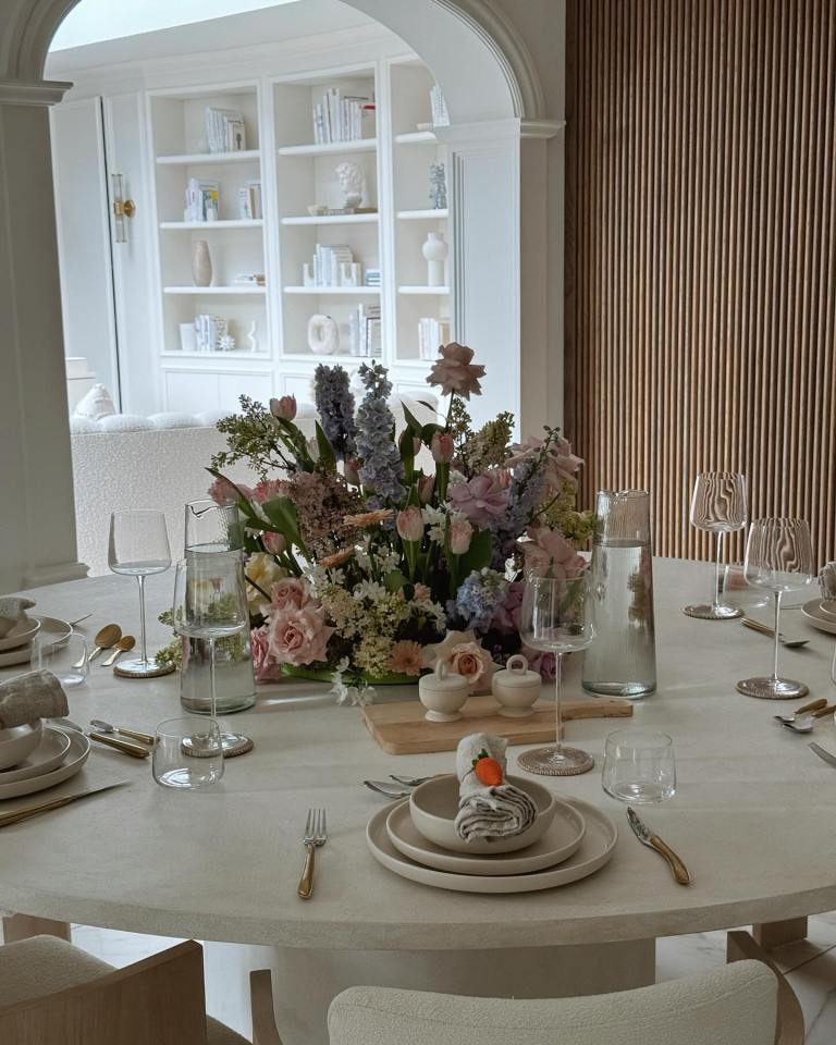 The round marble dining table was set as they prepared to welcome guests into their home