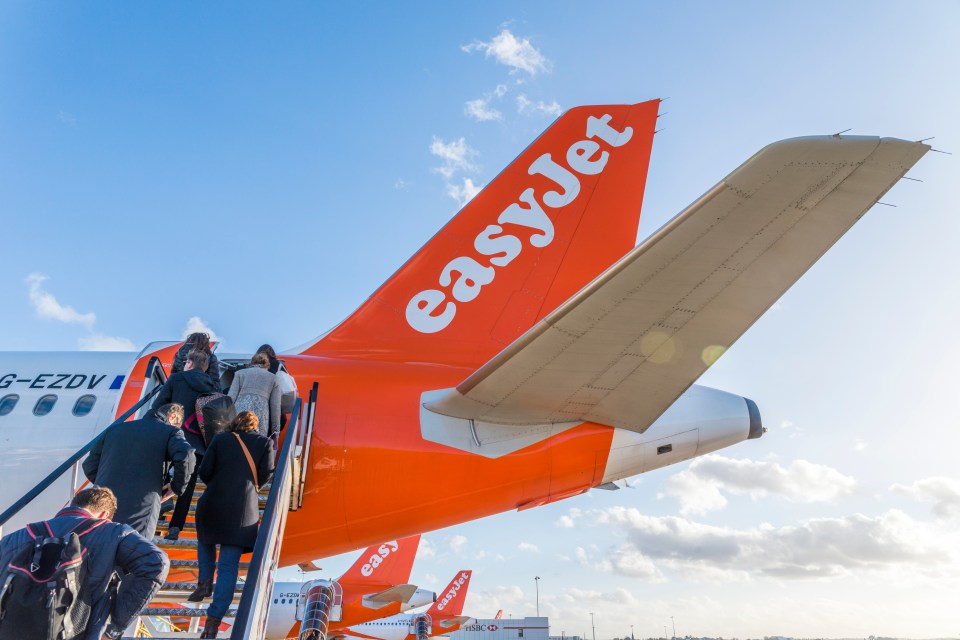 Passengers board an easyJet plane at London’s Gatwick airport