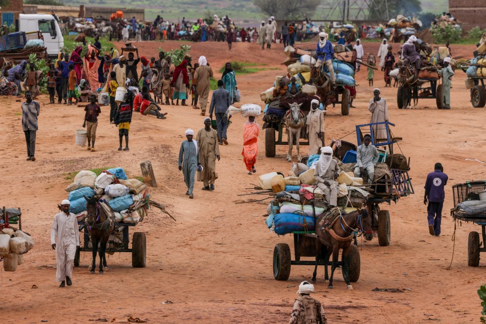 People flee the violence in West Darfur, crossing the border into Adre, Chad