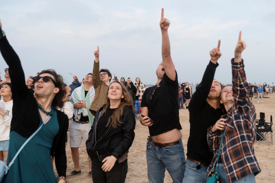 People watching Starship's lift off from the company’s Boca Chica launchpad