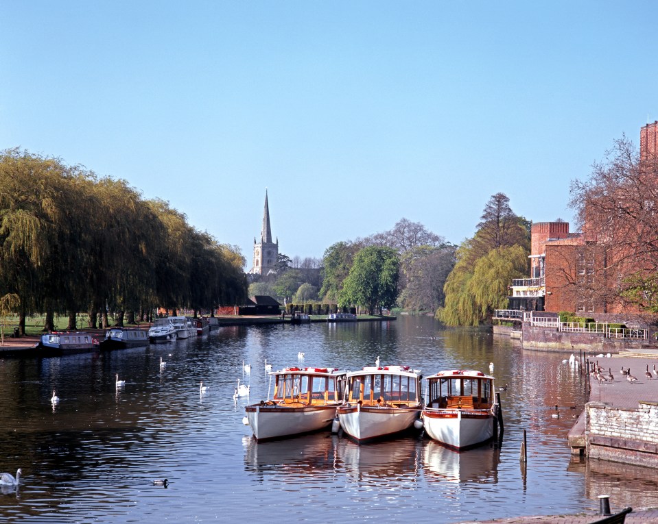 River Avon with pleasure boats moored and Church to rear, Stratford-Upon-Avon