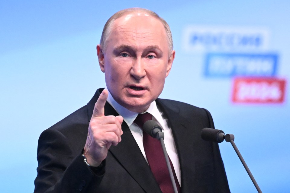 Putin meets with the media at his campaign headquarters in Moscow early Monday morning, local time